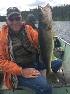 Proudly Showing off Catch in Reindeer lake