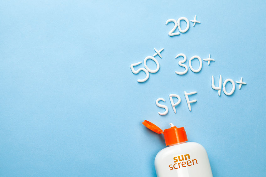 A bottle of sunscreen with "20+ 30+ 40+ 50+ SPF" Written in sunscreen