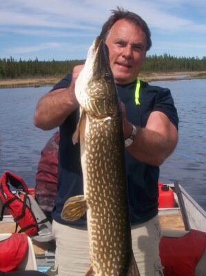 Man holding Fish in Saskatchewan