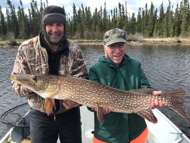 Smiling Men with Northern Pike
