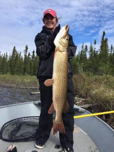 Woman Showing Off Catch from Reindeer Lake