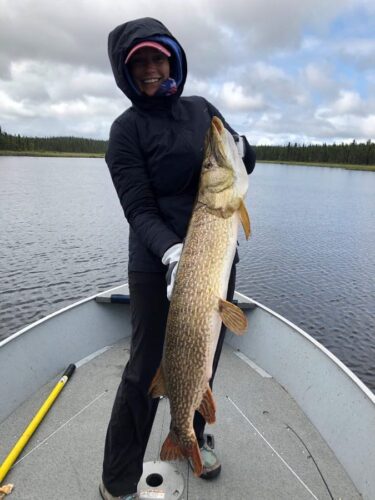 Man holding large Northern Pike